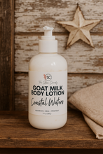 Load image into Gallery viewer, Goat milk tallow body lotion bottle on a wooden surface with a star decoration in the background.
